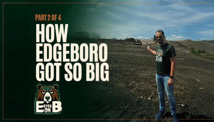 A man in sunglasses and an Eyes on EB t-shirt stands on the bare graded surface of the Edgeboro Road landfill under a blue sky, gesturing back over his shoulder toward the working face, with heavy equipment and a landfill ridge behind him. Overlaid title card reads: Eyes on EB, Part 2 of 4, How Edgeboro Got So Big.
