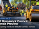East Brunswick Council to Vote on $1.1 Million Paving Bond and a $532,815 Increase to This Year’s Road Contract Illustration of a road crew paving a residential street with a dump truck, paver and roller, with the text "Township Council, Oct. 12: East Brunswick Council Agenda Preview, $1.1M paving bond and $532,815 contract increase"